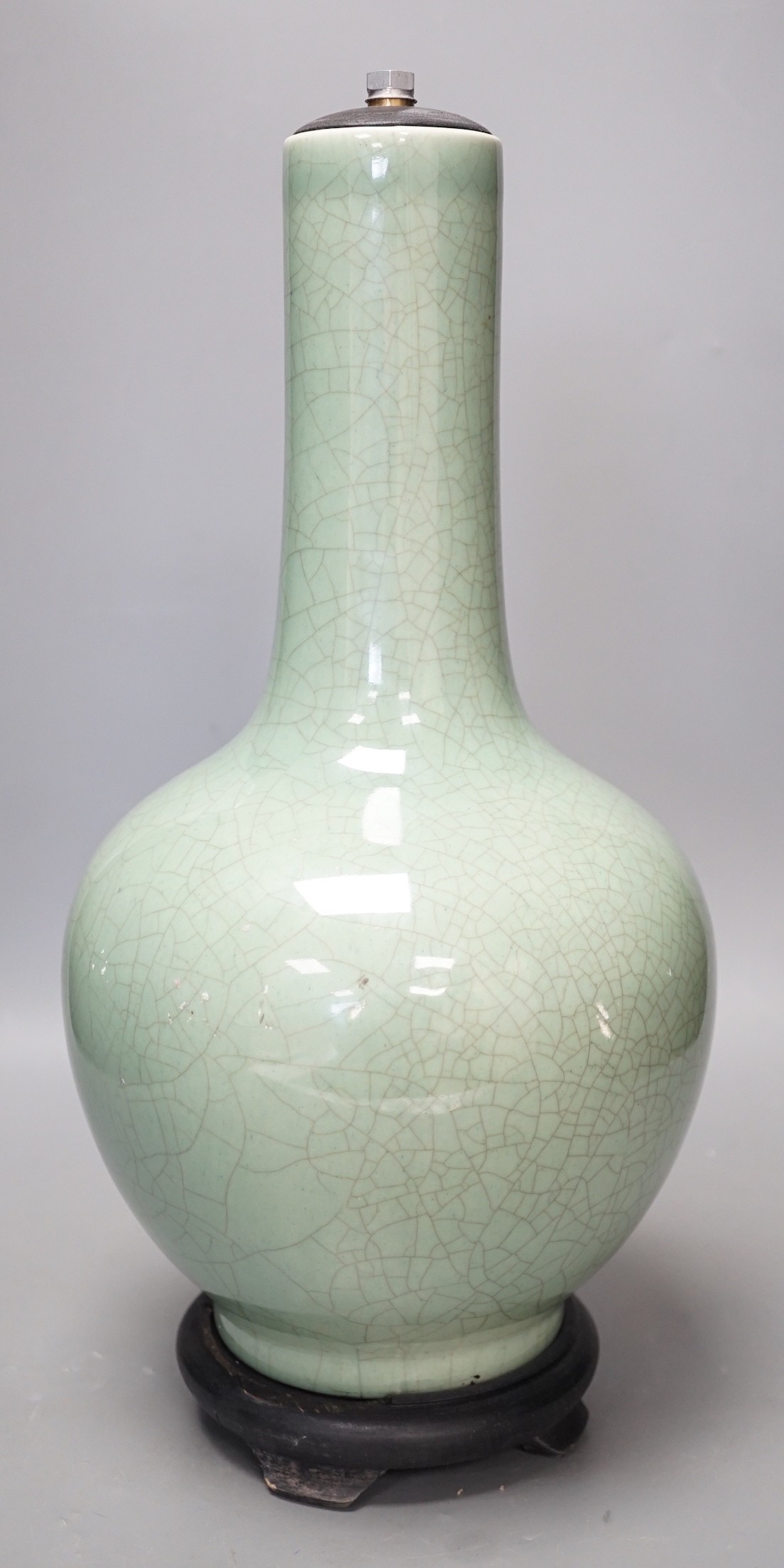 A Chinese celadon glazed Guan type vase on stand, 42cms high